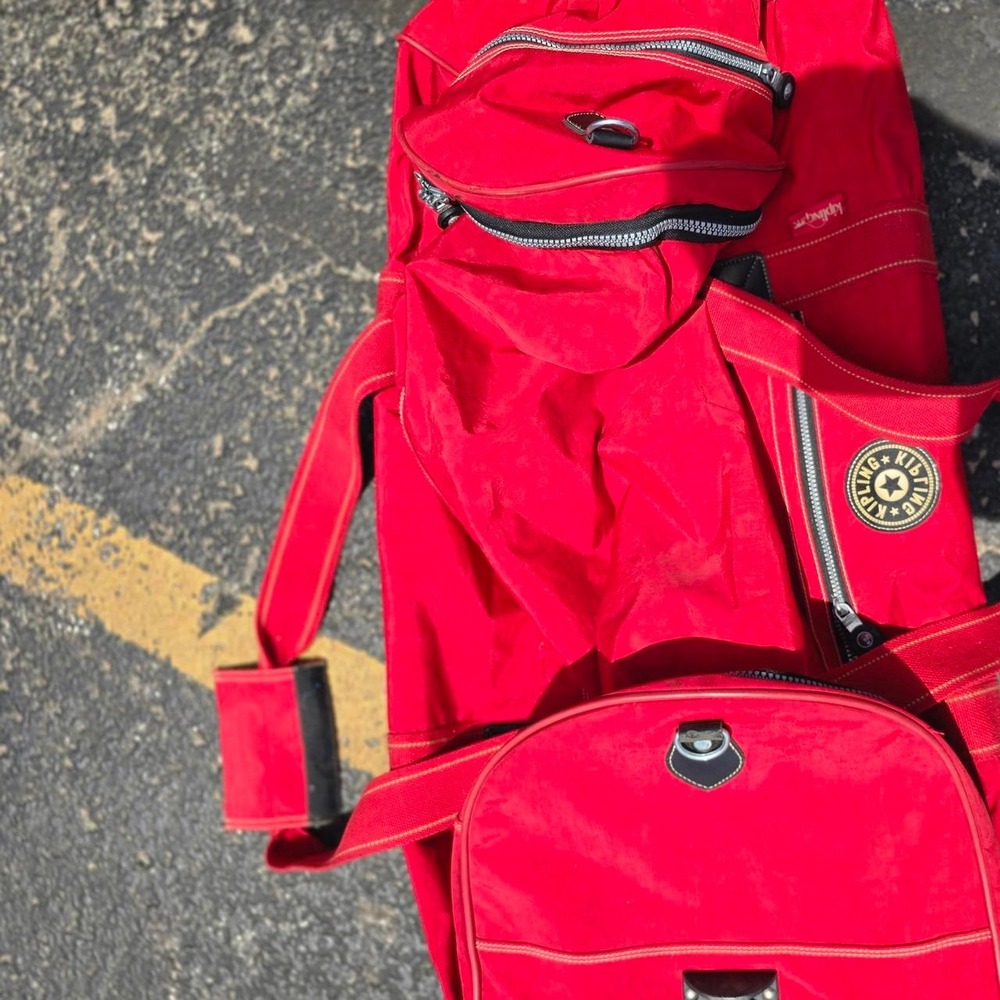 Red Kipling backpack with adjustable straps
